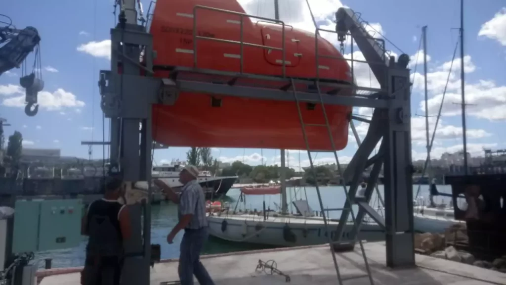 A lifeboat training complex for practicing shipboard launching operations by crews, students, and cadets of maritime educational institutions