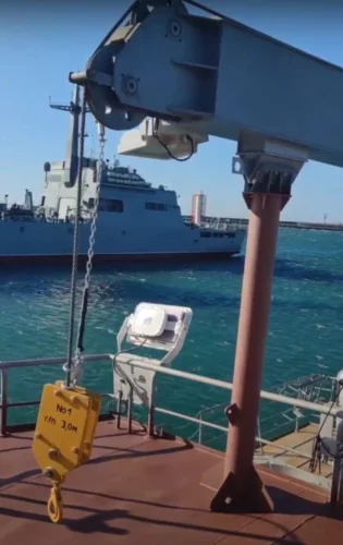 Boom of the GMK 27-9 deck marine crane on boom rest